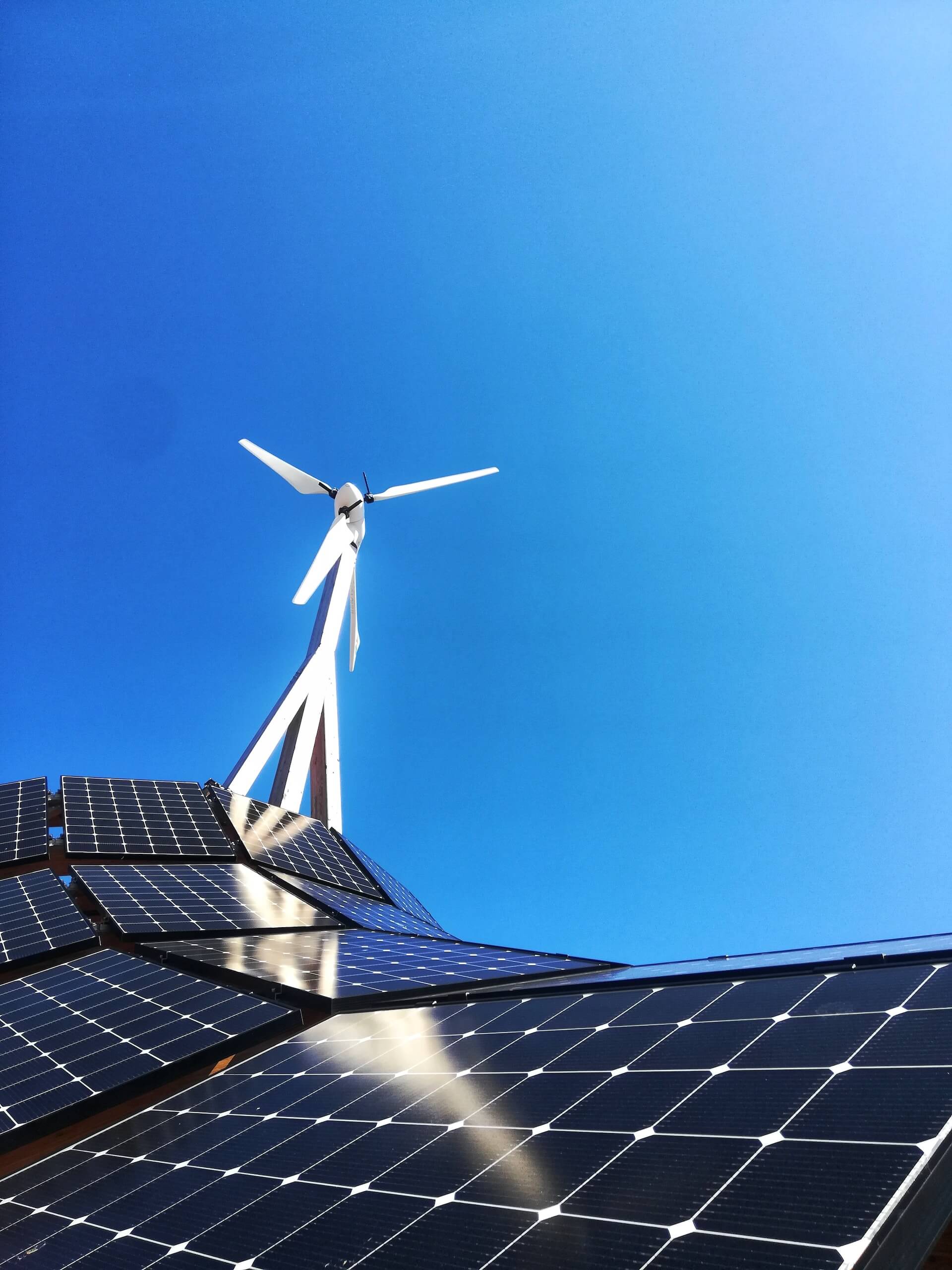 Windmill and Tracking Solar Mounting System with blue sky